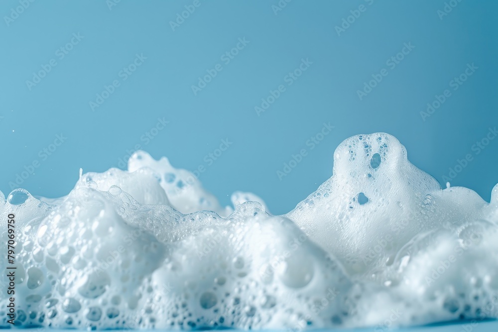 Close-up of white foam against a blue background Close-up of white foam against a blue background