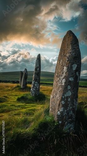 Ancient Standing Stones in a Lush Green Field at Sunset photo