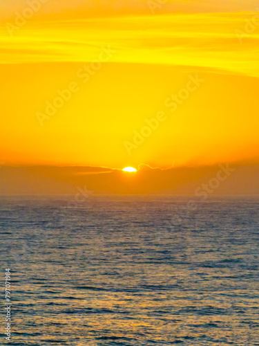 Fototapeta Naklejka Na Ścianę i Meble -  Summer sunrise at the seaside bay