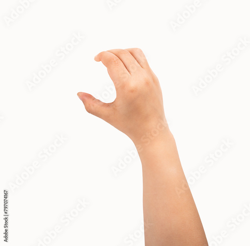 Close-up of child hand holding some like a blank object isolated on a white background photo