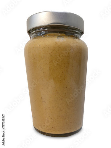 Smooth peanut butter in glass jar isolated