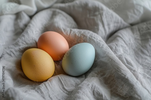 Colorful eggs nestled in soft fabric