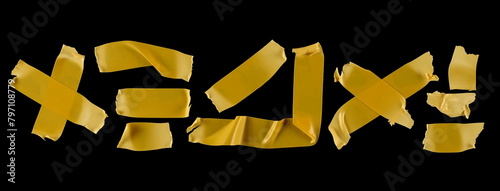 Set yellow adhesive tape, strips isolated on black background, top view  © dule964