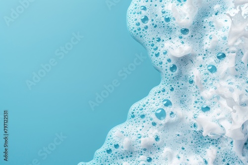 Close-up of blue foamy soap suds on a clean surface
