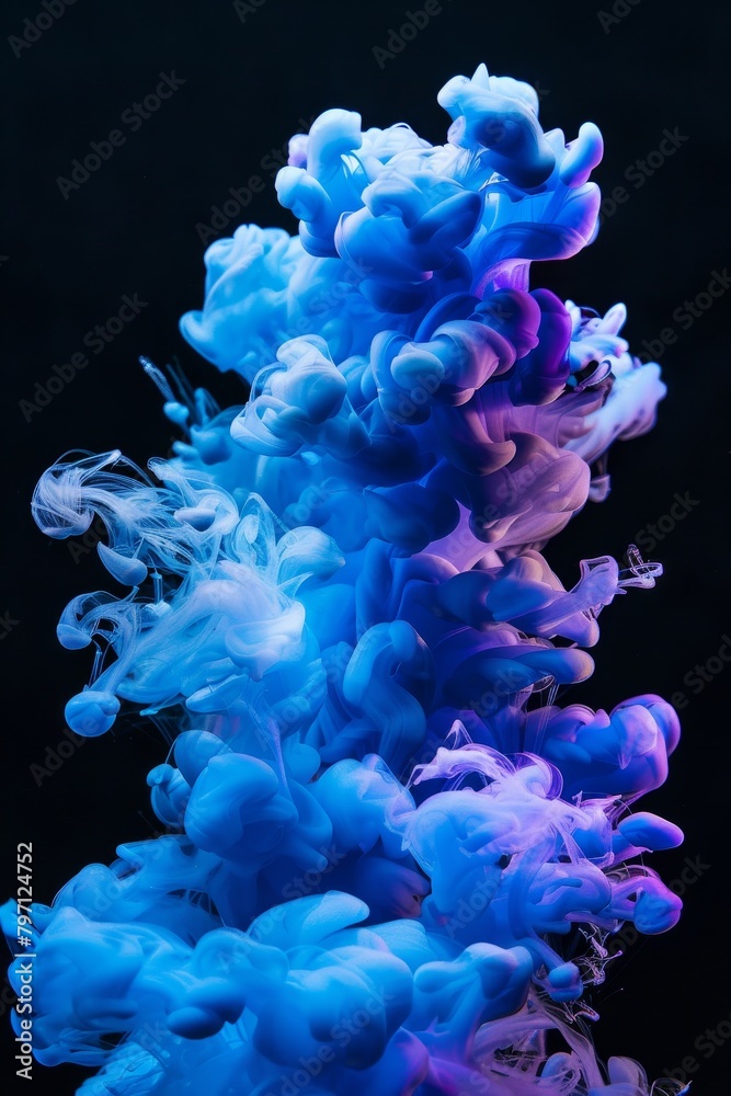 Obraz premium Vibrant blue and purple ink clouds in water