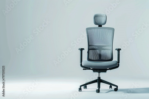 Contemporary office swivel chair with a mesh backrest and adjustable headrest, isolated on solid white background. photo