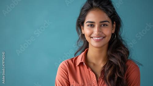 Young indian female teacher standing confidently photo