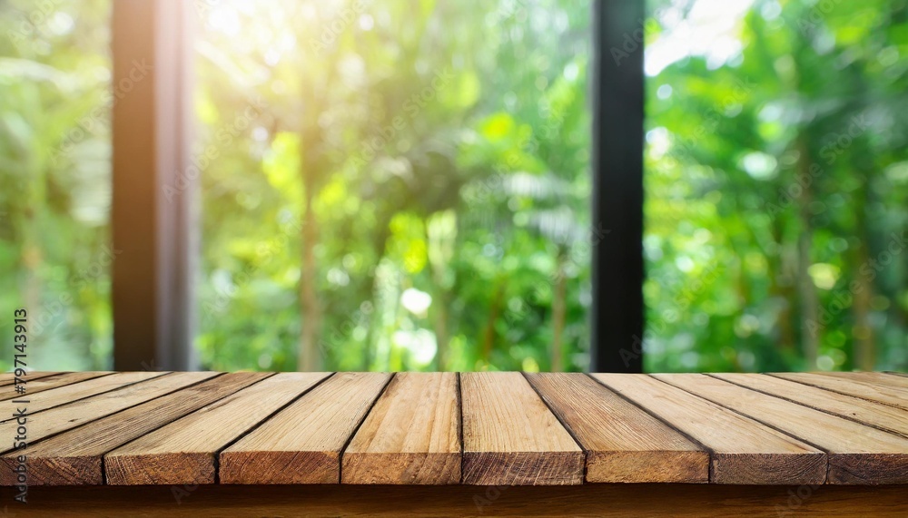 top of wood table counter on blur window view garden background