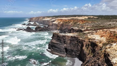 Scenic view of ocean waves crashing on high cliffs. Western coast of Portugal photo