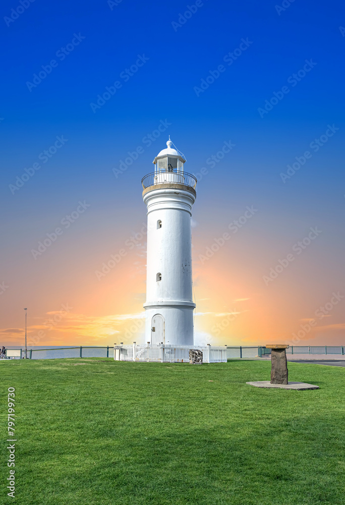 Beautiful lighthouse at Sunset over the Pacific Ocean on cliffs of Kiama Sydney NSW Australia Coastal Beach fishing Town