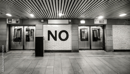 A black and white photo of a subway station with the word no photo