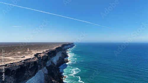 Aerial view of the Great Australian Bight and a jet contrail photo