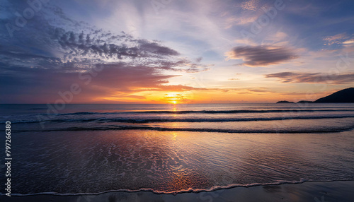 A fiery sunset  its vivid hues reflecting across a calm  mirror-like ocean  with gently sway