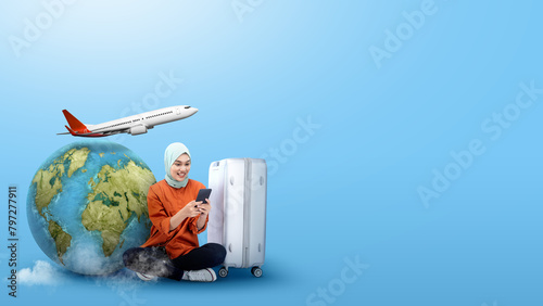 Holiday summer, vacation and travel concept with suitcase and other accessories against blue background.