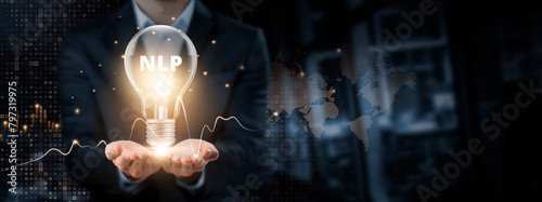 NLP: Insight Concept. Hands of businessman holding light bulb and NLP (Natural Language Processing) with data network digital technology. Advancing Communication, Analyzing Textual Data. photo