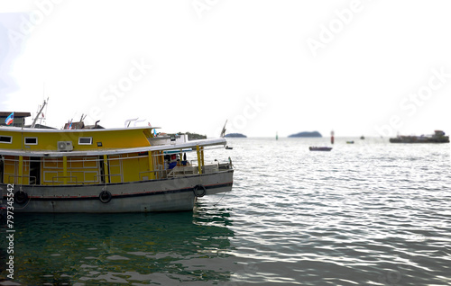 Yellow fishing boat on the shore of Kinabalu island in Sabah, Malaysia