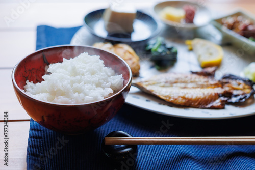 Japanese breakfast includes grilled fish, tofu, rice, Japanese pickled vegetables, and Japanese green tea.