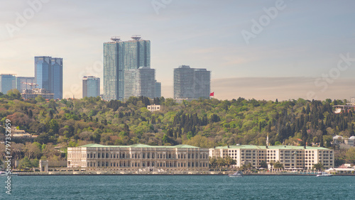 View from the Bosphorus strait of Ciragan Palace Kempinski, a luxury hotel located in Istanbul, Turkey. The palace was built in the 19th century and is now a popular tourist destination photo
