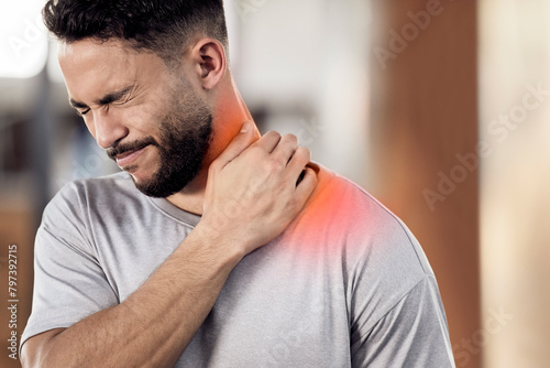 Man, athlete and neck pain in gym, inflammation and muscle sprain or tender from exercise. Male person, runner and red injury from marathon or training practice, hurt and ache or sport accident photo