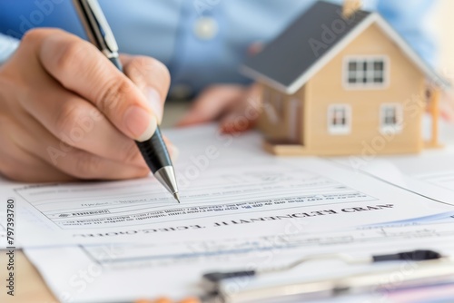 homeowner signing mortgage documents with a pen