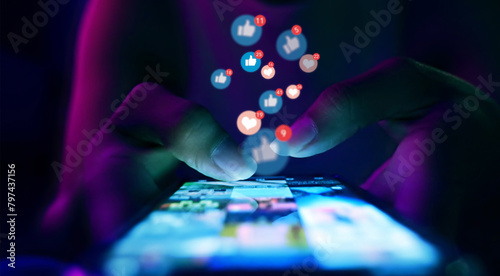 Finger of woman touching scroll page app on mobile phone.In a room with blue and purple neon tones.concept Social Media, Marketing, Post - Structure, Image-based Social Media, like buttons 