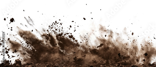 Dirt and soil particles billow up into the air on white background.