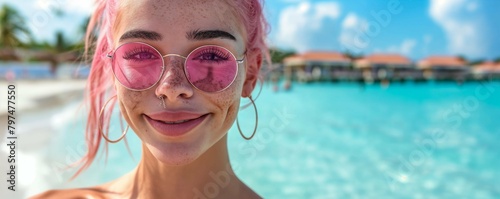 Happy teenager on summer vacation in a luxury resort. Summer holidays concept.. Portrait of a beautiful teenage tattooed influencer with pink hair and piercings having fun at a luxury resort