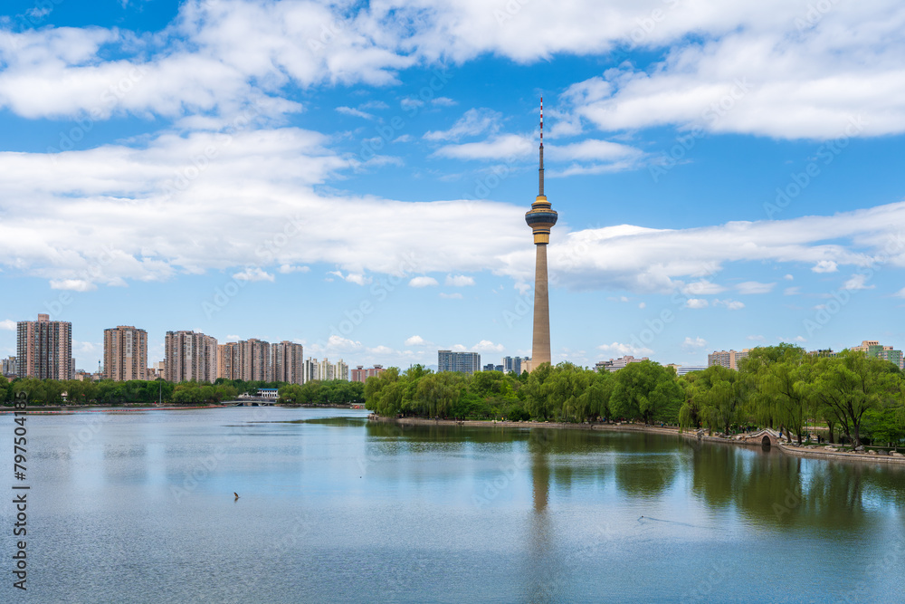 Naklejka premium Beautiful view of Yuyuantan park with jumping carp and CCTV tower of Beijing