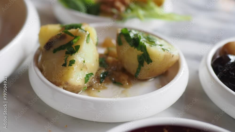 fork pick boiled potatoes on breakfast table fork pick boiled potatoes on breakfast table