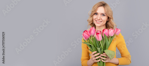 Girl with spring tulips flowers. lady hold flowers for spring holiday. girl with bouquet. Woman isolated face portrait, banner with mock up copy space.