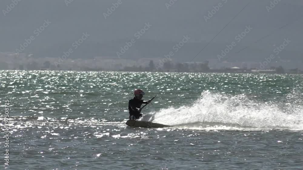 Man Kitesurfing at the beach in Ebro delta, Catalonia, Spain. High quality 4k footage Man Kitesurfing at the beach in Ebro delta, Catalonia, Spain. High quality 4k footage