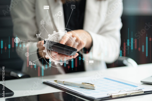 Businesswoman working with tablet and using a calculator to calculate the numbers of static in office. Finance accounting concept.