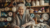 An old woman with arthritis is smiling while knitting in a countryside craft store. 