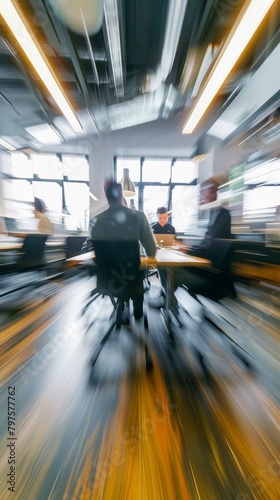 strong motion blur of of average office people casualy chatting in an office at work photo