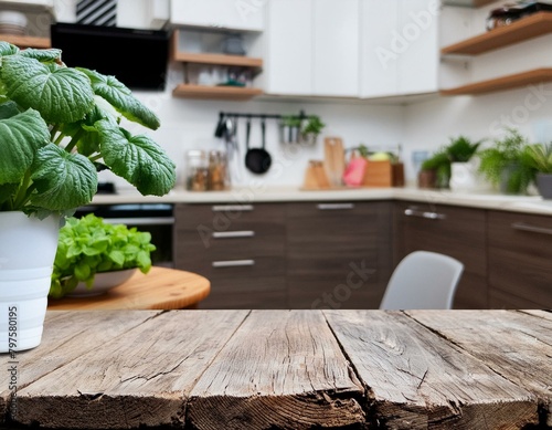 Wood table top with green plants on blur kitchen counter (room)background. photo