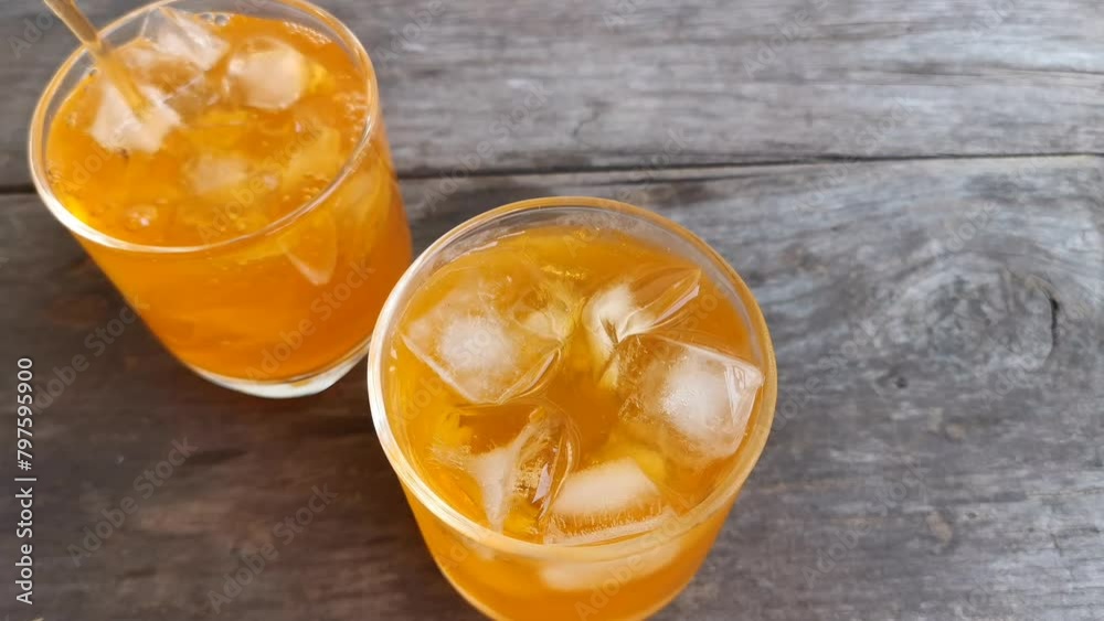 Orange soft drink and ice cubes Orange soft drink and ice cubes