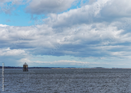 The Larrick Beacon in the middle of the Tay Estuary, seen from Tayport, with the beaches of Broughty Ferry and Monefieth in the background.