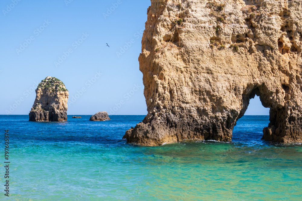 Balanced complementary symmetry of rocks at a heavenly beach near Portimão, Algarve, Portugal