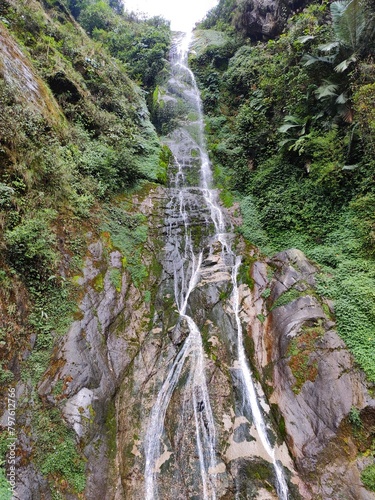 Nichiphula waterfall flow into the kameng river in a deep valley surrounded by mountains of the himalayas near Dedza, arunachal pradesh, India. 