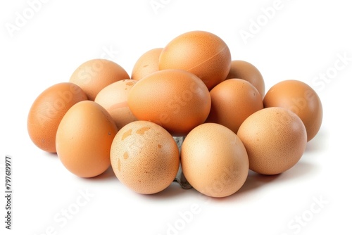 A cluster of fresh brown chicken eggs with a natural speckled pattern isolated on a white background.