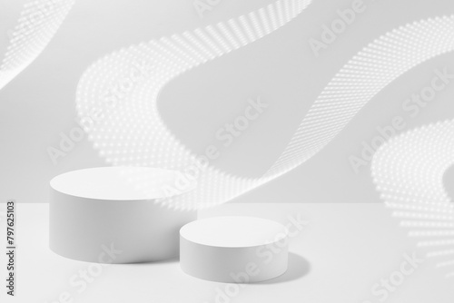 Abstract white scene mockup - two round white cylinder podiums, dotted neon light waves. Template for presentation cosmetic products, goods, advertising, design, sale, design, sale in fashion style.