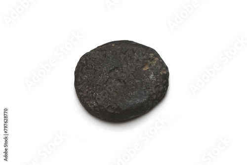 The shape is round, flat and thick of tektite natural stone meteorite isolated on white background.
