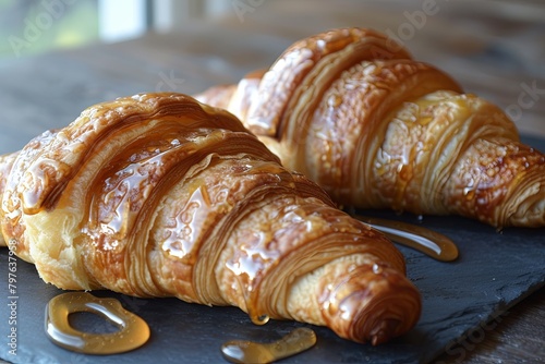 Golden Honey Croissants on Dark Slate: Homemade Brunch Delight