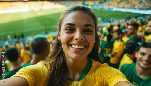 Selfie of spectator in the stadium celebrating with his team and the green and yellow colors. Brazil fans.  Woman