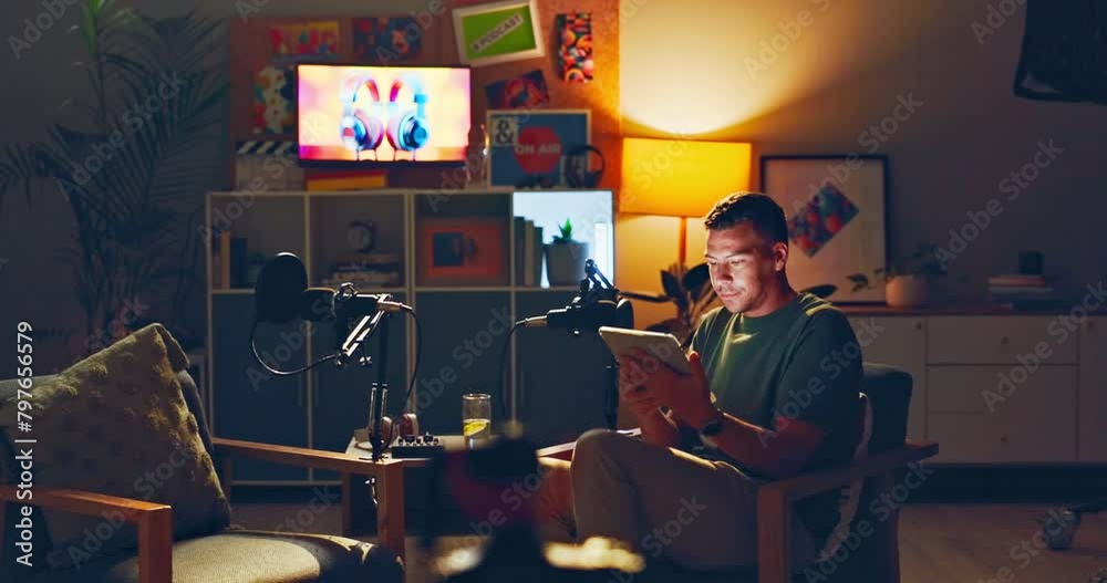 Night, office and man relax with tablet for digital editing, audio and sound design for content creation. Producer, social media and person on technology for podcast, radio presenter or talk show