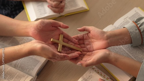 Sense of devotion and spiritual fulfill with christian catholic follower immerse in faith. Slow motion christian people practicing group prayer, holding hand while praying together. Burgeoning photo
