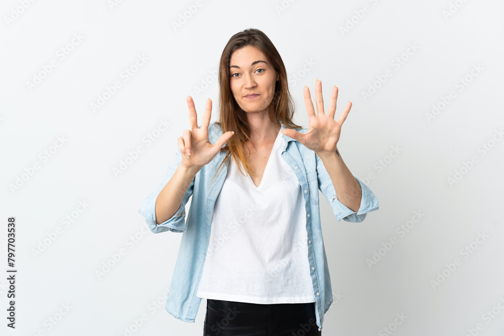 Young Ireland woman isolated on white background counting eight with fingers Young Ireland woman isolated on white background counting eight with fingers