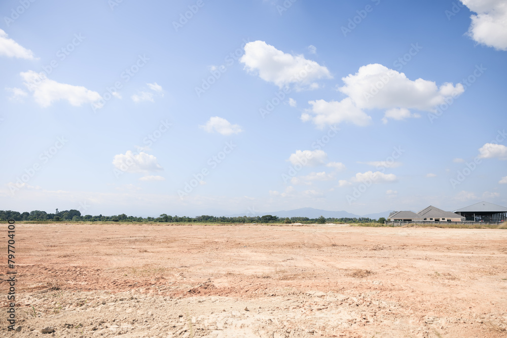 Fototapeta premium Land, blue sky and clouds. Include landscape, empty or vacant area at outdoor. Real estate or property for sale, rent, but, development, housing subdivision and construction in Chiang Mai of Thailand.