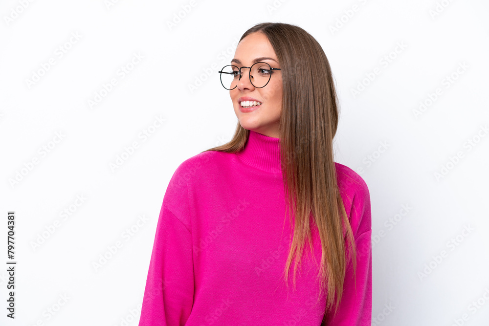 Young caucasian woman isolated on white background looking to the side and smiling Young caucasian woman isolated on white background looking to the side and smiling