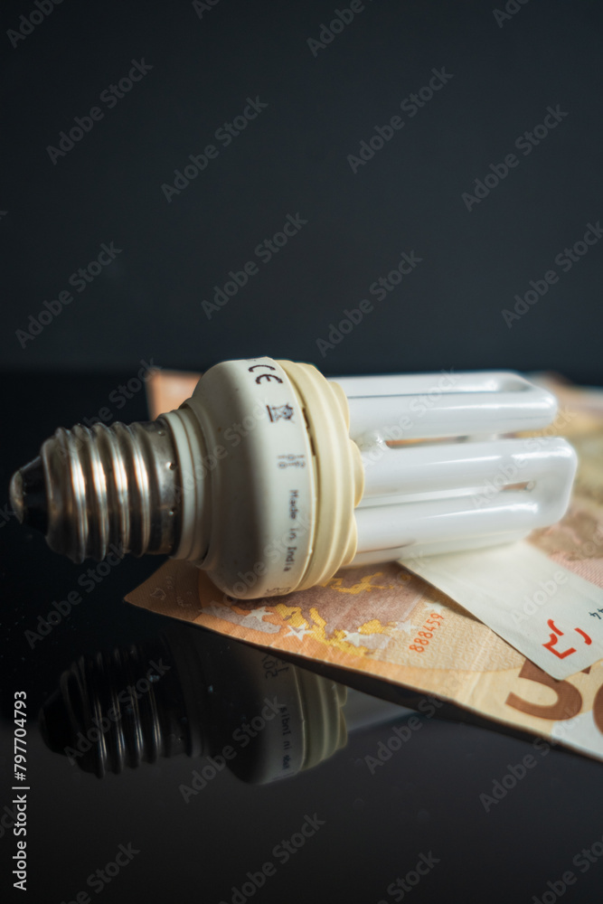 Light bulb with 50 euro note bills , Increase in electricity tariffs